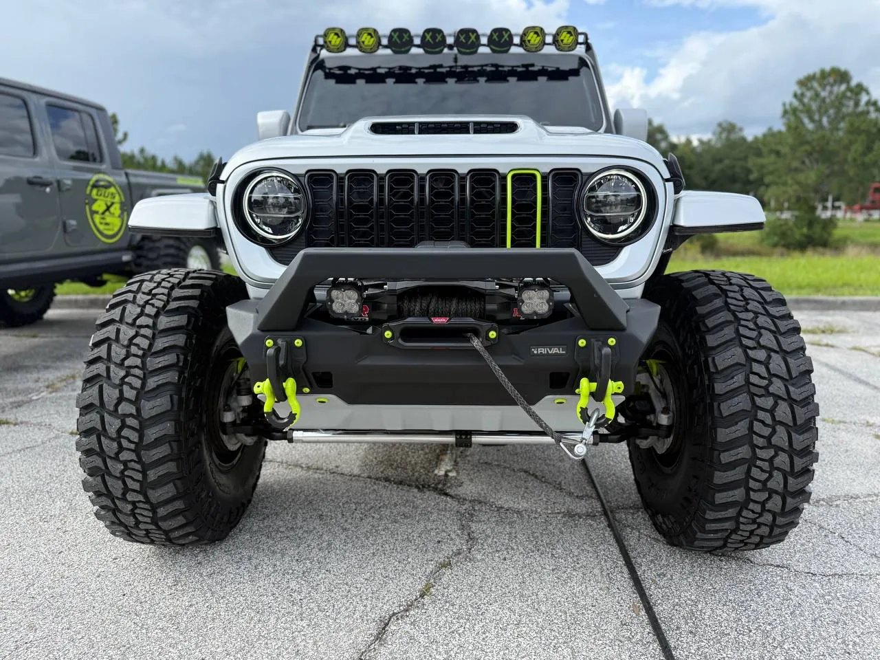 Gray Gladiator front view with green light bar accents