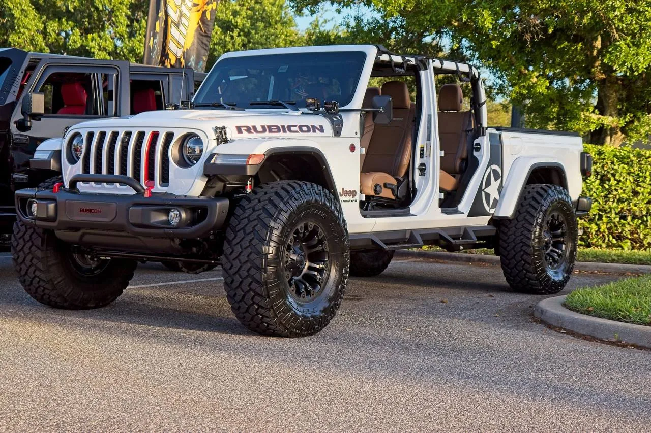 White Jeep Gladiator Rubicon with topless setup and red interior